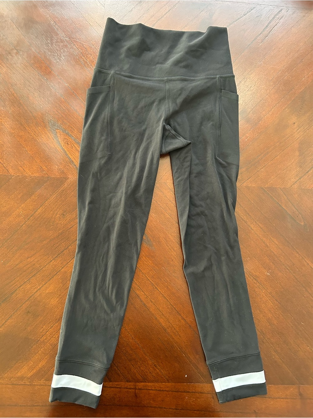Athleta Black Leggings with Reflective Hem Stripes size xxs